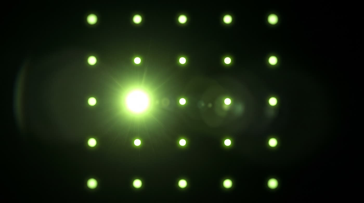 A grid of small glowing lime dots on black with one dot dramatically brighter